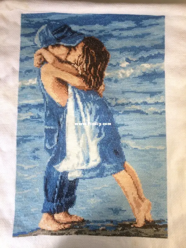 boy and girl kissing on the beach