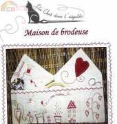Un chat dans l'aiguille Maison de brodeuse