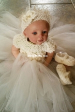 Here is my little crochet dress and her little slippers