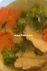 Chicken soup with vegetables (carrot like a flowers)