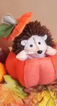 Felt hedgehog in pumpkin