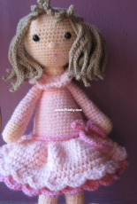 a little doll in pink