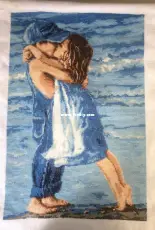 Boy and Girl kissing on the beach