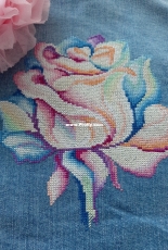 Cross stitch on a denim jacket