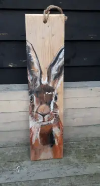 hare painted on scaffolding wood