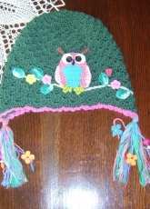 Green hat with owl