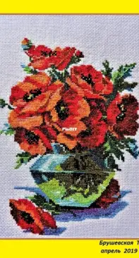 Cross stitch. Poppies in a vase