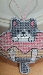 Cat in a doughnut