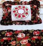 a little pillow with red roses