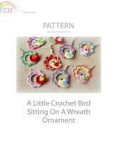 Zoom Yummy - A Little Crochet Bird Sitting On A Wreath Ornament