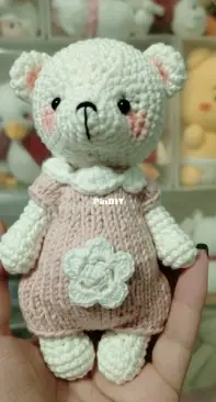 Teddy bear with pink jumpsuit
