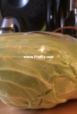 Roasted cabbage roll served by tzatzíki
