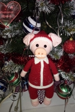 little pig in Santa Claus costume