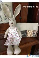 stuffed rabbit and patchwork purse